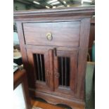 A teak bedside cabinet.