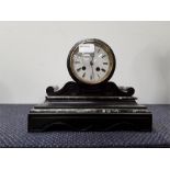 A granite mantle clock with enamel face.