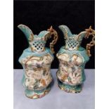 A pair of decorative majolica design ceramic ewers.