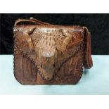 A small native Alligator handbag.