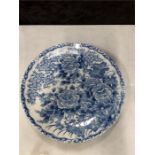 A blue and white floral pattern Chinese plate.