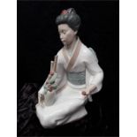 Large Japanese Lladro figure. (13 1/2 inches).