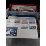 A quantity of first day covers, postcards and cigarette cards.