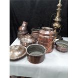 A quantity of Turkish copper cooking items and a brass lamp.