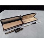 An original boxed early usa made white and gold coloured Sheaffer fountain pen with Palladian silver