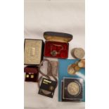 A box containing earrings, coins etc.