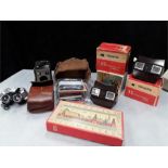 Two boxed Bakelite viewmasters with colour pictures, Kodak Brownie camera, eye viewers etc.
