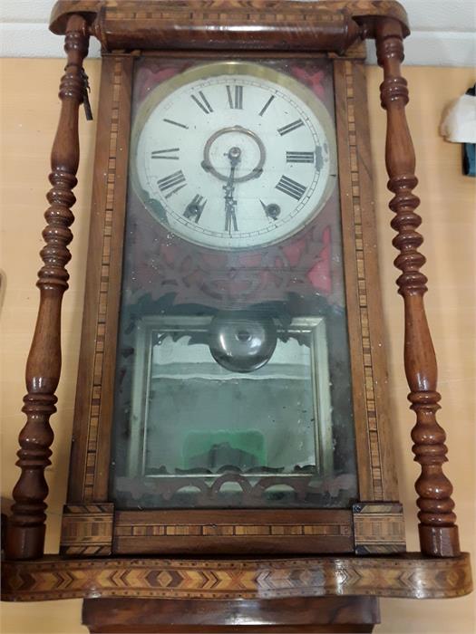 A wooden cased American style clock (AF).