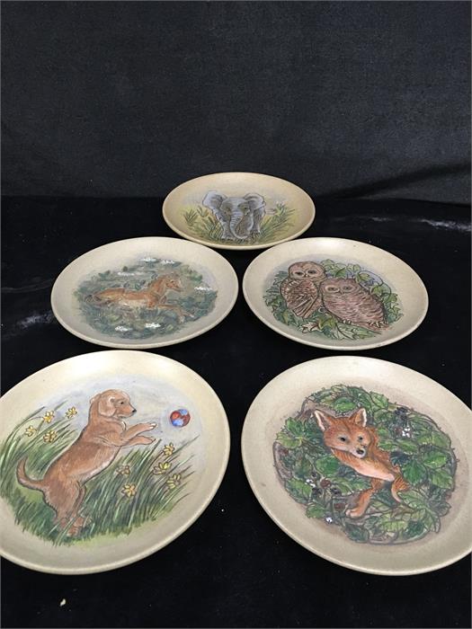 Five Poole Pottery stoneware plates designed by Barbara Linley Adams and decorated with acrylics.