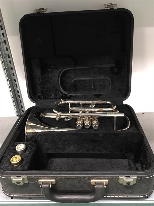 A trumpet by Boosey and Hawkes of London in case.