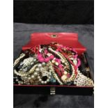 A box of various costume jewellery.