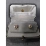 A Pair of "Pearl" earrings. in a Collingwood of London box