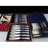 A quantity of plated cased sets of cutlery.