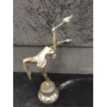 A Bronze Art Deco lady holding torches on marble base.