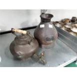 An antique copper dutch design kettle with spout, ivory handle and a copper jug.