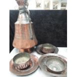 A quantity of copper Turkish market embossed bowls, pitcher etc.