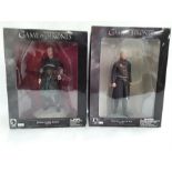 Two boxed Game of Thrones figures, Jorah Mormont and Tywin Lannister.