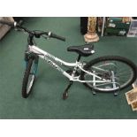 An Apollo Vivia kid’s mountain bike with twin bike stand. 18 speed with front suspension and in good