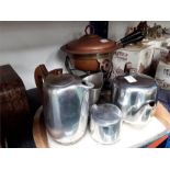 A set of Picquot ware with pewter dishes and a copper fondue pot.