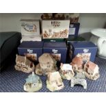 A collection of Lilliput Lane cottage models.