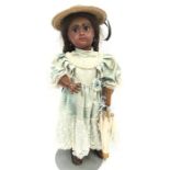 Late 19th century Jumeau (France) black bisque head doll impressed '8' to back of head and '0' at