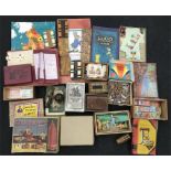 Quantity of early 20th century games and puzzles, includes John Bull Printing Outfit, a crib