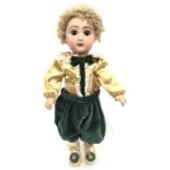 Jumeau (France) bisque head doll with fixed brown glass eyes, open mouth with teeth, pierced ears,