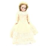 Bisque shoulder-head doll with blonde mohair/ real hair wig, fixed blue eyes, closed mouth and