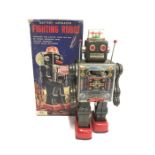 Horikawa (Japan) Fighting Robot, c.1960's: battery operated tinplate robot in dark grey with red