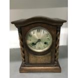 An oak cased chiming mantle clock, Hansford, Poole.