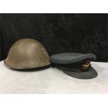 RAF hat in blue cloth together with tin helmet in green.