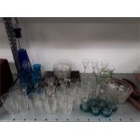 A quantity of glasses, cut coloured glass decanter, air twist, finger bowls, etc.