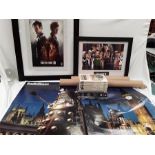 Two framed posters depicting Dr Who, three other posters, DVDs and books.