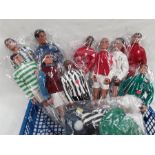 Ten Action men footballers.