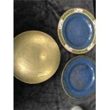 A brass bowl together with two blue glazed plates in the oriental style.