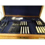 A Mappin and Webb large wooden box of cutlery (some missing).