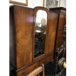 A 1930s 1940s walnut wardrobe.