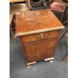 A small mahogany bedside unit.