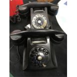 Two vintage Bakelite telephones.