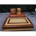 A Mauchline ware money box, a leather jewellery box and two other boxes.