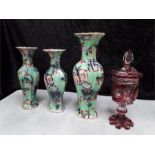 Three vases decorated in floral design together with a red pattern design glass lidded pot.