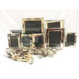 A quantity of silver plated photo frames together with other silver and silver plate.