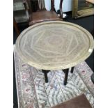 A brass topped tiffin table.