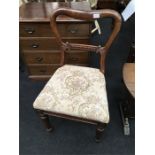 A Victorian rosewood carved back dining chair.