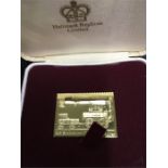A box containing a single replica stamp in 22ct gold weighing 26.6 grams. Please handle the