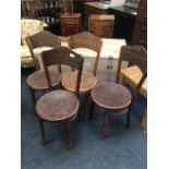 Four bentwood chairs.