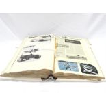 A large scrapbook containing images and diagrams of planes.