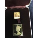 A box with two replica stamps in 22ct gold (The Penny Black and £1) ( 38.1 grams)Please handle the