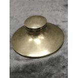 A silver capstan inkwell.