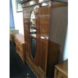 A mahogany mirror door wardrobe. fitted draws